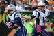 Oct 6, 2013; Cincinnati, OH, USA; New England Patriots quarterback Tom Brady (12) hands the ball off to running back LeGarrette Blount (29) in the first quarter against the Cincinnati Bengals at Paul Brown Stadium. Mandatory Credit: Marc Lebryk-USA TODAY Sports
