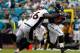 JACKSONVILLE, FL - SEPTEMBER 12: Robert Ayers #56 of the Denver Broncos attempts to tackle Mike Thomas #80 of the Jacksonville Jaguars during the NFL season opener game at EverBank Field on September 12, 2010 in Jacksonville, Florida. (Photo by Sam Greenwood/Getty Images)