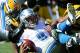 GREEN BAY, WI - OCTOBER 06: Matthew Stafford #9 of the Detroit Lions reacts after a sack by Mike Neal #96 of the Green Bay Packers on third down during the third quarter at Lambeau Field on October 6, 2013 in Green Bay, Wisconsin. (Photo by Harry How/Getty Images)