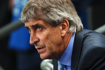 Hi-res-182829583-manuel-pellegrini-coach-of-manchester-city-looks-on_crop_north