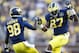 Oct 5, 2013; Ann Arbor, MI, USA; Michigan Wolverines tight end Devin Funchess (87) celebrates his forty six yard reception with quarterback Devin Gardner (98) in the fourth quarter against the Minnesota Golden Gophers at Michigan Stadium. Michigan won 42-13. Mandatory Credit: Rick Osentoski-USA TODAY Sports