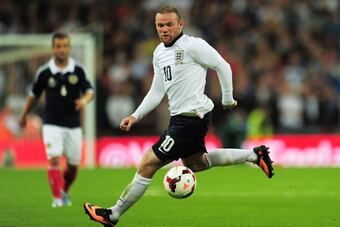 Hi-res-176611431-wayne-rooney-of-england-runs-with-the-ball-during-the_crop_north