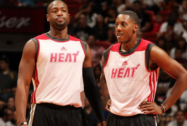 Hi-res-183592295-dwyane-wade-and-mario-chalmers-of-the-miami-heat-share_crop_north