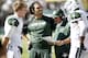 EAST RUTHERFORD, NJ - SEPTEMBER 8: Matt Simms #5, Mark Sanchez #6 of the New York Jets and Geno Smith #7 of the NEw York Jets confer with offensive coordinator Marty Mornhinweg during their game against the Tampa Bay Buccaneers at MetLife Stadium on September 8, 2013 in East Rutherford, New Jersey. (Photo by Jeff Zelevansky/Getty Images)