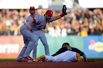183589508-matt-carpenter-of-the-st-louis-cardinals-tags-out-josh_crop_north