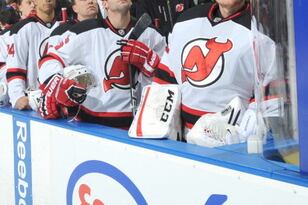 183735063-members-of-the-new-jersey-devils-stand-for-the-playing_crop_north