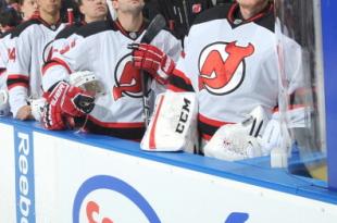 183735063-members-of-the-new-jersey-devils-stand-for-the-playing_crop_north