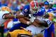 GAINESVILLE, FL - OCTOBER 06: Tharold Simon #24 of the LSU Tigers tackles Jeff Driskel #6 of the Florida Gators during the game at Ben Hill Griffin Stadium on October 6, 2012 in Gainesville, Florida. (Photo by Sam Greenwood/Getty Images)