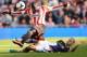 SUNDERLAND, ENGLAND - SEPTEMBER 29: Martin Skrtel of Liverpool tackles Jozy Altidore of Sunderland during the Barclays Premier League match between Sunderland and Liverpool at the Stadium of Light on September 29, 2013 in Sunderland, England. (Photo by Gareth Copley/Getty Images)