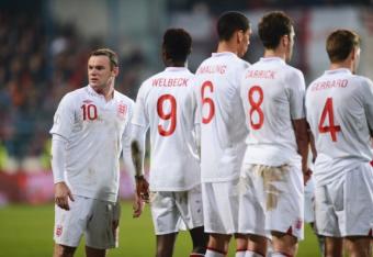 164692032-wayne-rooney-of-england-looks-on-as-he-he-stands-in-the_crop_north