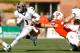 COLUMBUS, OH - NOVEMBER 17: Dri Archer #1 of the Kent State Golden Flashes breaks a tackle by Paul Swan #33 of the Bowling Green Falcons on November 17, 2012 at Doyt Perry Stadium in Bowling Green, Ohio. Kent State defeated Bowling Green 31-24. (Photo by Kirk Irwin/Getty Images)