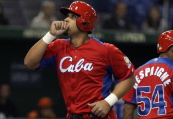 163505530-jose-abreu-of-cuba-celebrates-after-hits-a-solo-home_crop_north