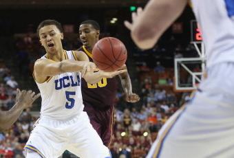 164358337-kyle-anderson-of-the-ucla-bruins-passes-the-ball-in_crop_north