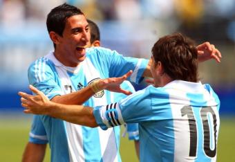 146065404-lionel-messi-of-argentina-is-congratulated-by-teammate_crop_north