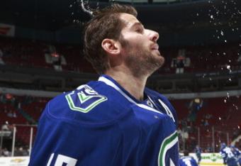 183669101-ryan-kesler-of-the-vancouver-canucks-wets-his-hair-as_crop_north