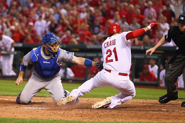 Hi-res-175654707-allen-craig-of-the-st-louis-cardinals-is-tagged-out-at_crop_north
