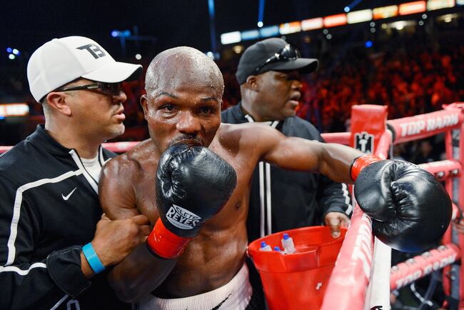 Hi-res-163890399-welterweight-champion-timothy-bradley-is-helped-back-to_crop_north