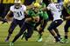 EUGENE, OR - OCTOBER 6: Quarterback Marcus Mariota #8 of the Oregon Ducks scrambles out of the pocket during the first quarter of the game against the Washington Huskies on October 6, 2012 at Autzen Stadium in Eugene, Oregon. Oregon won the game 52-21. (Photo by Steve Dykes/Getty Images)