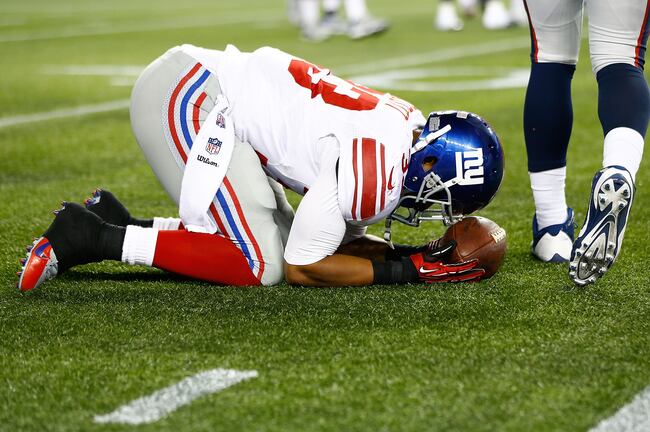 Hi-res-178405637-darel-scott-of-the-new-york-giants-reacts-after-being_crop_north