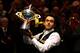 SHEFFIELD, ENGLAND - MAY 06: Ronnie O'Sullivan of England poses with the trophy and his son Ronnie after beating Barry Hawkins of England to win the Betfair World Snooker Championship at the Crucible Theatre on May 6, 2013 in Sheffield, England. (Photo by Warren Little/Getty Images)