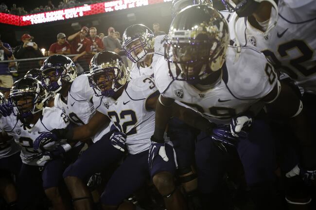 Hi-res-184047370-members-of-the-washington-huskies-football-team-chants_crop_north