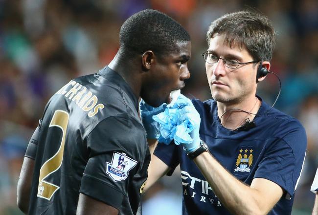 Hi-res-174336825-micah-richards-of-mancester-city-is-treated-by-medical_crop_north