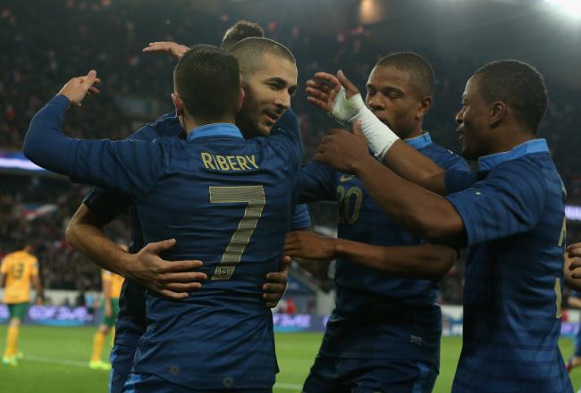 Hi-res-184074515-karim-benzema-of-france-is-mobbed-by-team-mates-after_crop_north