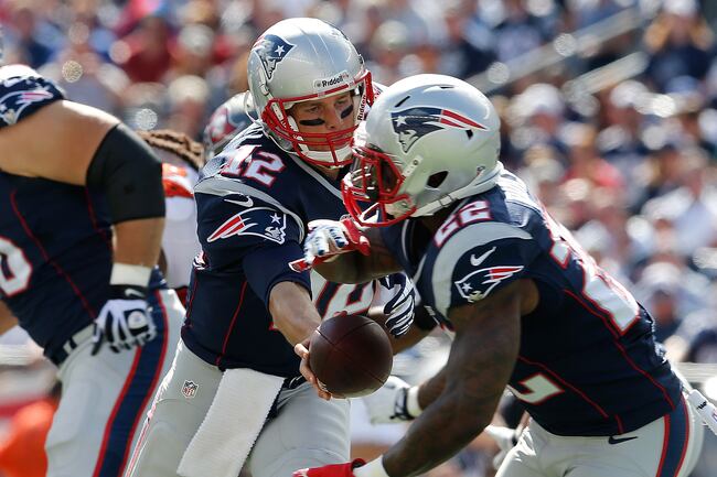Hi-res-181576760-tom-brady-of-the-new-england-patriots-hands-the-ball-to_crop_north