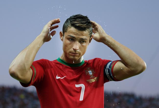 Hi-res-176517209-cristiano-ronaldo-of-portugal-brushes-his-hair-with_crop_north
