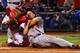ST LOUIS, MO - OCTOBER 11: Mark Ellis #14 of the Los Angeles Dodgers is out at home plate in the 10th inning against Yadier Molina #4 of the St. Louis Cardinals during Game One of the National League Championship Series at Busch Stadium on October 11, 2013 in St Louis, Missouri. (Photo by Dilip Vishwanat/Getty Images)