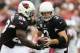 GLENDALE, AZ - OCTOBER 06: Quarterback Carson Palmer #3 of the Arizona Cardinals hands off the football to Rashard Mendenhall #28 during the NFL game against the Carolina Panthers at the University of Phoenix Stadium on October 6, 2013 in Glendale, Arizona. The Cardinals defeated the Panthers 22-6. (Photo by Christian Petersen/Getty Images)