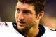 Aug 22, 2013; Detroit, MI, USA; New England Patriots quarterback Tim Tebow (5) on the sidelines in the second quarter of a preseason game against the Detroit Lions at Ford Field. Mandatory Credit: Andrew Weber-USA TODAY Sports