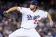 LOS ANGELES, CA - OCTOBER 07: Starting pitcher Clayton Kershaw #22 of the Los Angeles Dodgers pitches in the second inning against the Atlanta Braves in Game Four of the National League Division Series at Dodger Stadium on October 7, 2013 in Los Angeles, California. (Photo by Stephen Dunn/Getty Images)