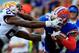 GAINESVILLE, FL - OCTOBER 06: Tharold Simon #24 of the LSU Tigers attempts to tackle Quinton Dunbar #1 of the Florida Gators during the game at Ben Hill Griffin Stadium on October 6, 2012 in Gainesville, Florida. (Photo by Sam Greenwood/Getty Images)