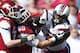 FAYETTEVILLE, AR - OCTOBER12: Jadeveon Clowney #7 of the South Carolina Gamecocks rushes the quarterback and is blocked by David Hurd #69 of the Arkansas Razorbacks at Razorback Stadium on October 12, 2013 in Fayetteville, Arkansas. (Photo by Wesley Hitt/Getty Images)