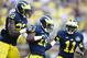 Oct 5, 2013; Ann Arbor, MI, USA; Michigan Wolverines defensive back Blake Countess (18) receives congratulations from safety Jarrod Wilson (22) and cornerback Courtney Avery (11) after scoring on a interception return in the fourth quarter against the Minnesota Golden Gophers at Michigan Stadium. Michigan won 42-13. Mandatory Credit: Rick Osentoski-USA TODAY Sports