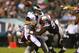 PHILADELPHIA, PA - AUGUST 09: Nick Foles #9 of the Philadelphia Eagles fumbles the ball as he is sacked by Tommy Kelly #93 and Chandler Jones #95 of the New England Patriots on August 9, 2013 at Lincoln Financial Field in Philadelphia, Pennslyvania. (Photo by Elsa/Getty Images)