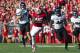 Oct 12, 2013; Madison, WI, USA; Wisconsin Badgers running back Melvin Gordon (25) rushes with the football as Northwestern Wildcats linebackers Eric Hauser (54) and Damien Proby (46) chase from behind during the second quarter at Camp Randall Stadium. Mandatory Credit: Jeff Hanisch-USA TODAY Sports