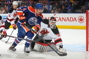 Hi-res-183605855-taylor-hall-of-the-edmonton-oilers-skates-past-martin_crop_north