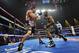 LAS VEGAS, NV - OCTOBER 12: WBO welterweight champion Timothy Bradley Jr. (R) throws a right punch at Juan Manuel Marquez during their bout at the Thomas & Mack Center on October 12, 2013 in Las Vegas, Nevada. (Photo by Jeff Bottari/Getty Images)