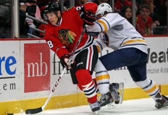 184245463-ben-smith-of-the-chicago-blackhawks-controls-the-puck_crop_north