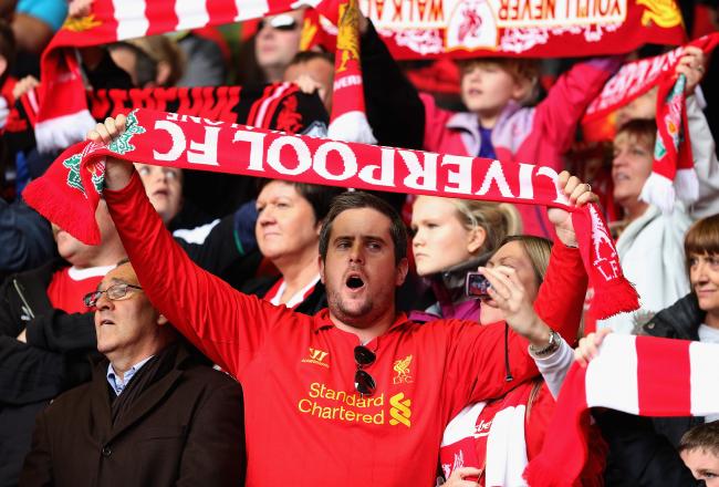 Hi-res-183158906-liverpool-fan-sings-during-the-barclays-premier-league_crop_north