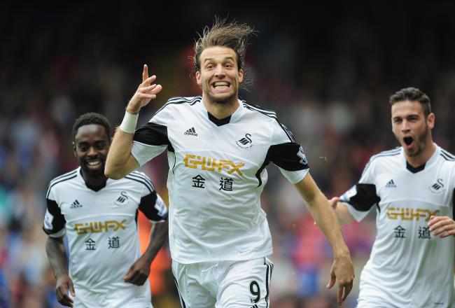 Hi-res-181531845-michu-of-swansea-city-celebtates-his-goal-during-the_crop_north