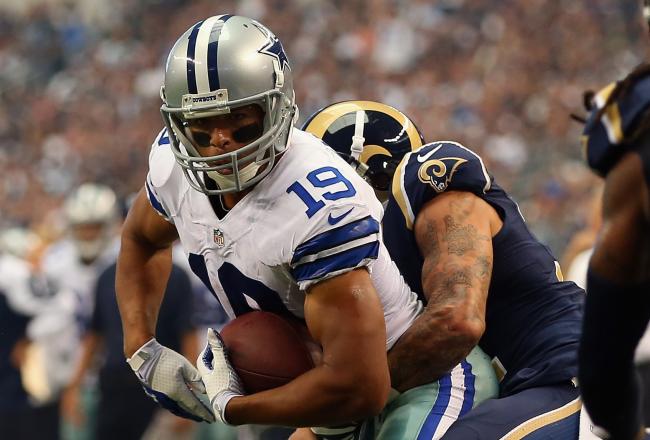 Hi-res-181566511-miles-austin-of-the-dallas-cowboys-is-tackled-by_crop_north