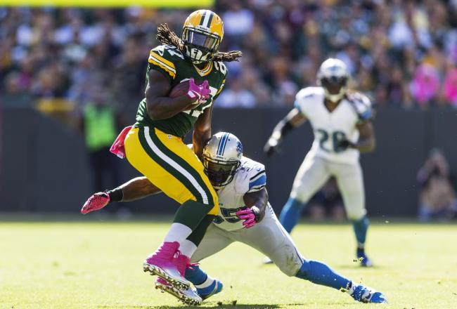 Hi-res-183447615-eddie-lacy-of-the-green-bay-packers-tries-to-spin-away_crop_north