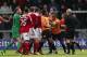 LONDON, ENGLAND - OCTOBER 13: Refereee Nick Kinseley steps in as players square up after Barnet player manager Edgar Davids (3rd R) elbowed Steven Wright of Wrexham in the face during the Skrill Conference Premier match between Barnet and Wrexham AFC at The Hive Stadium on October 13, 2013 in London, England. (Photo by Charlie Crowhurst/Getty Images)