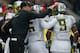SEATTLE, WA - OCTOBER 12: Head coach Mark Helfrich of the Oregon Ducks pats running back Byron Marshall #9 on the head after he scored a touchdown in the second quarter against the Washington Huskies on October 12, 2013 at Husky Stadium in Seattle, Washington. The Ducks defeated the Huskies 45-24. (Photo by Otto Greule Jr/Getty Images)