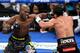 LAS VEGAS, NV - OCTOBER 12: WBO welterweight champion Timothy Bradley Jr. (L) hits Juan Manuel Marquez in the seventh round of their bout at the Thomas & Mack Center on October 12, 2013 in Las Vegas, Nevada. Bradley won in a split decision. (Photo by Ethan Miller/Getty Images)