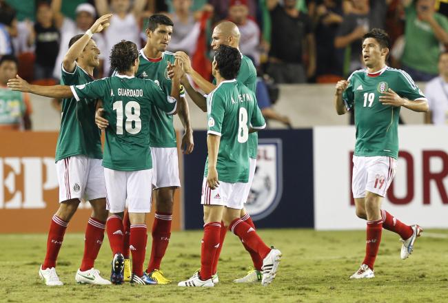Hi-res-154043034-andres-guadardo-of-mexico-celebrates-his-goal-with_crop_north