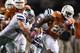 AUSTIN, TX - SEPTEMBER 21: Malcolm Brown #28 of the Texas Longhorns runs the ball against Jonathan Truman #21 of the Kansas State Wildcats at Darrell K Royal-Texas Memorial Stadium on September 21, 2013 in Austin, Texas. (Photo by Ronald Martinez/Getty Images)